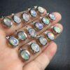 nice oval shape natural opal bead inlaid sterling silver charm