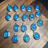 oval shape natural blue opal bead inlaid sterling silver charm