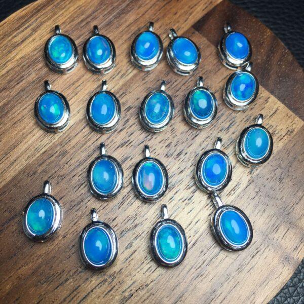 oval shape natural blue opal bead inlaid sterling silver charm