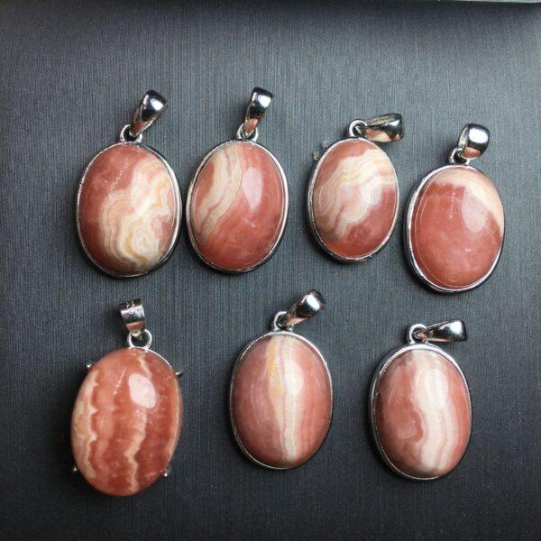 oval shape natural rhodochrosite bead inlaid sterling silver charm
