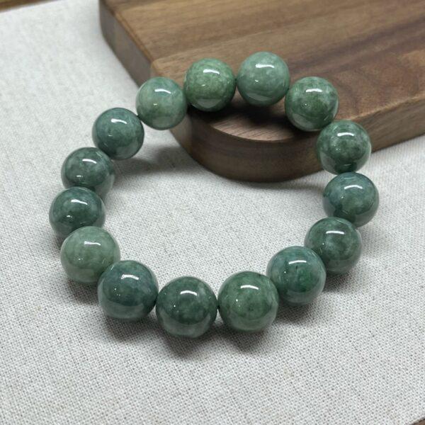 8mm - 13mm round shape natural oily green jadeite beaded bracelet - Image 5