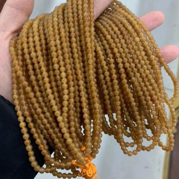 nephrite bead, round bead, whole strand bead, brown bead, caramel bead, clear bead, jade bead, high quality bead, genuine bead, natural bead